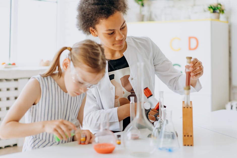 A teacher and student engage in a hands-on science experiment in a classroom setting.